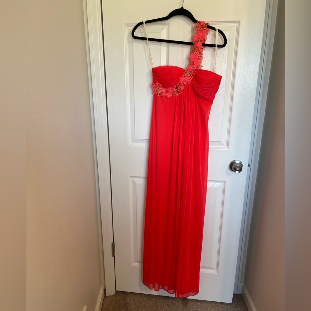 Bright coral pink prom or bridesmaid dress with embroidered cross shoulder